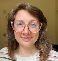 Photo of a woman in glasses. 